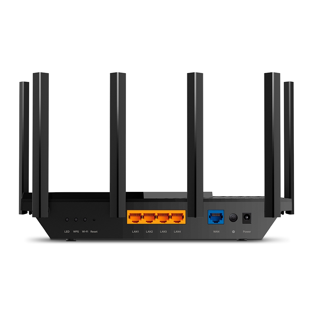 Rear of black TP-Link Archer AX73 showing four orange LAN sockets, blue WAN socket, controls and power connection