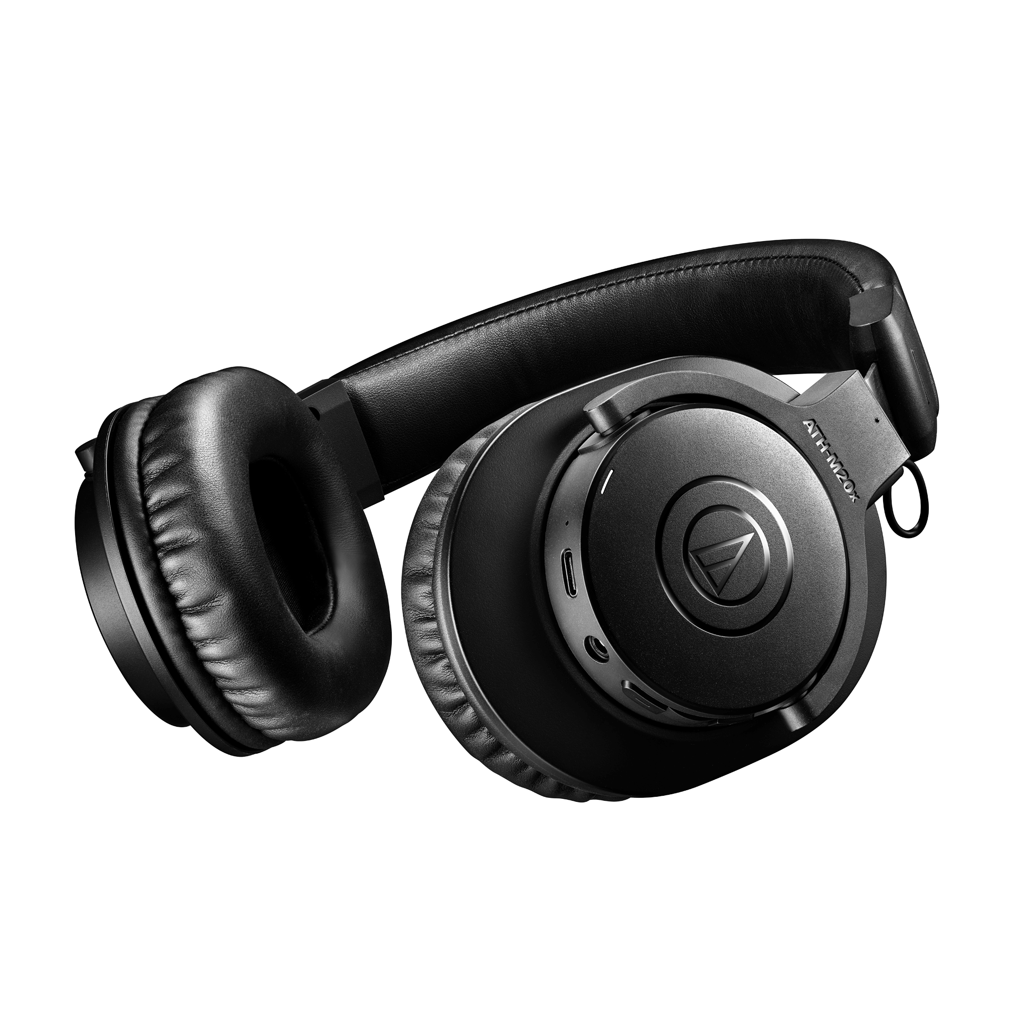 Side view of Audio-Technica ATH-M20xBT earcup showing Audio-Technica logo