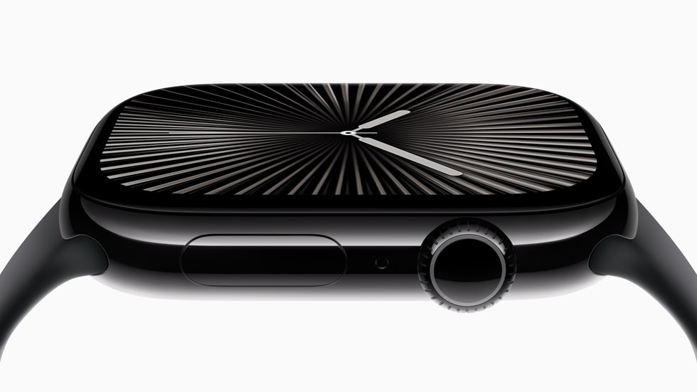 Close-up side profile of Apple Watch Series 10 Jet Black aluminum case showing the digital crown, side button and Black Sport Band