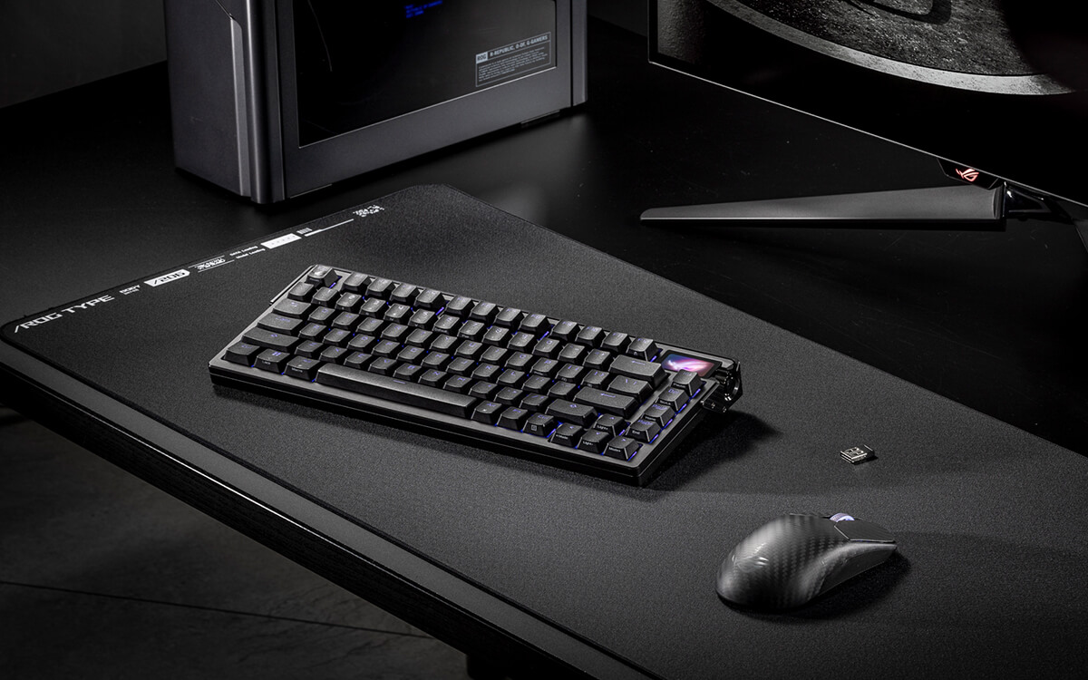 Low-angle side view of the ROG Azoth Extreme keyboard showing its carbon-fiber-pattern side panel, ROG logo and RF receiver