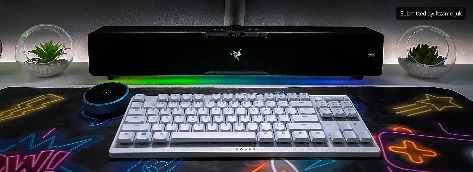 Straight-on front view of the Razer Leviathan V2 Pro soundbar in black showing the THX badge, Razer logo and RGB underglow