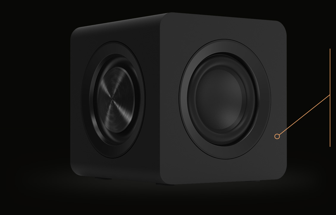 Side view of the Creative Pebble X Plus cube-shaped subwoofer showing the driver and passive radiator