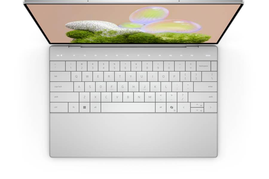 Dell XPS 13 9350 laptop in Platinum, top-down view of keyboard, trackpad and open display