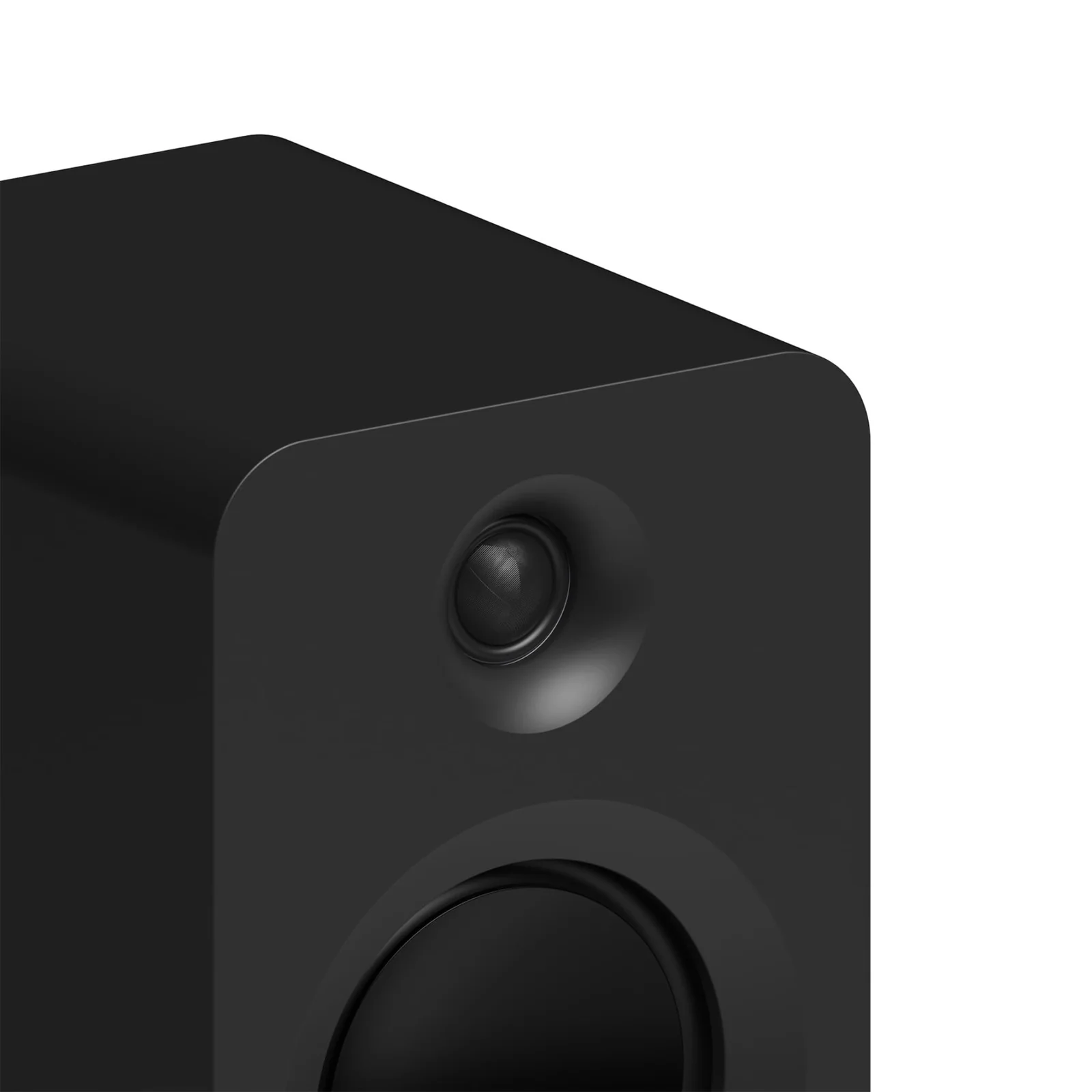Close-up detail of the Kanto REN Matte Black cabinet corner, tweeter and woofer